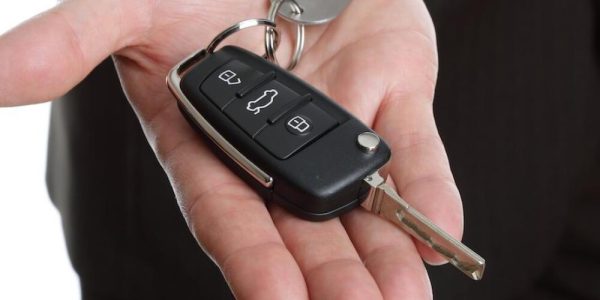 kia car key on the palm of a hand
