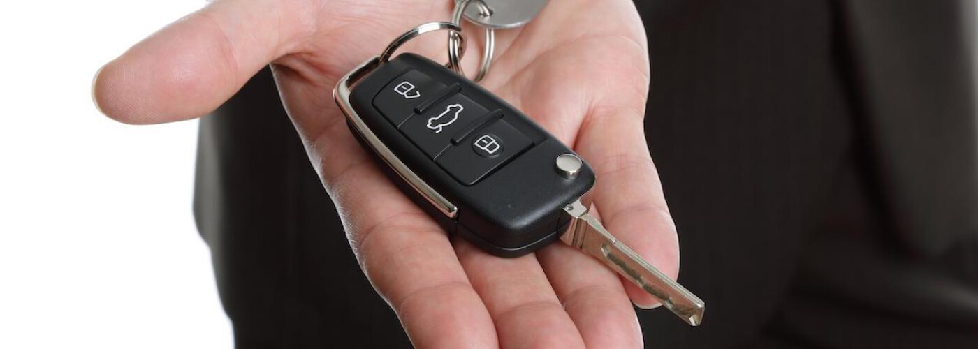 kia car key on the palm of a hand